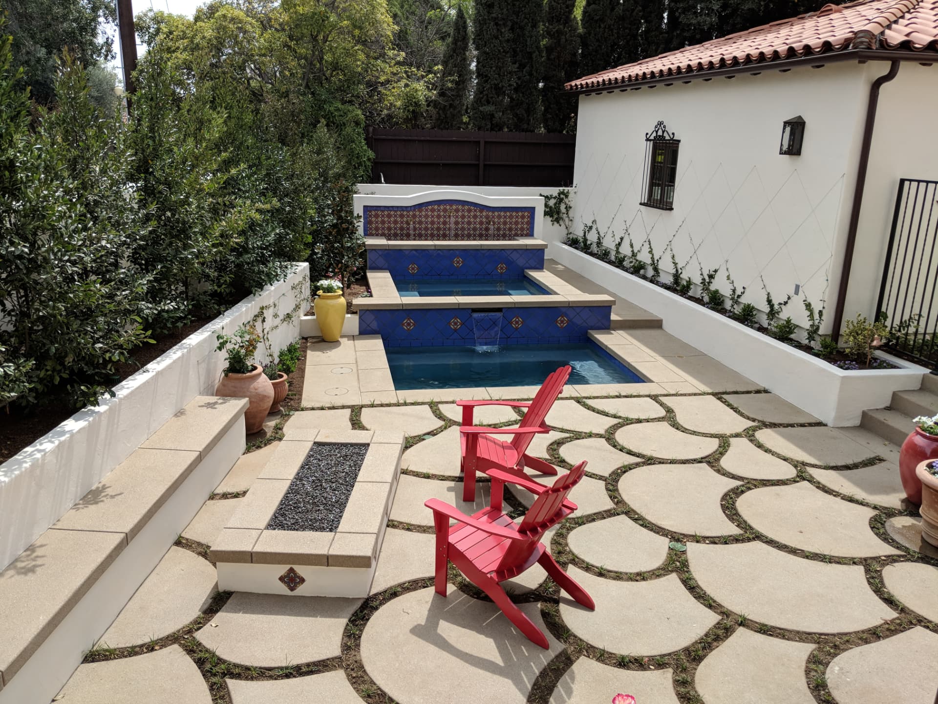 Mission style multi level pool and spa with cobalt blue tile